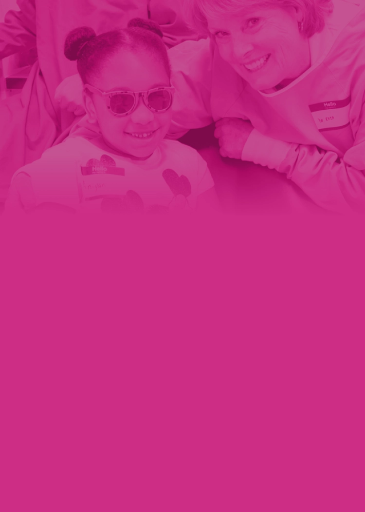 A young girl and a female provider smiling.