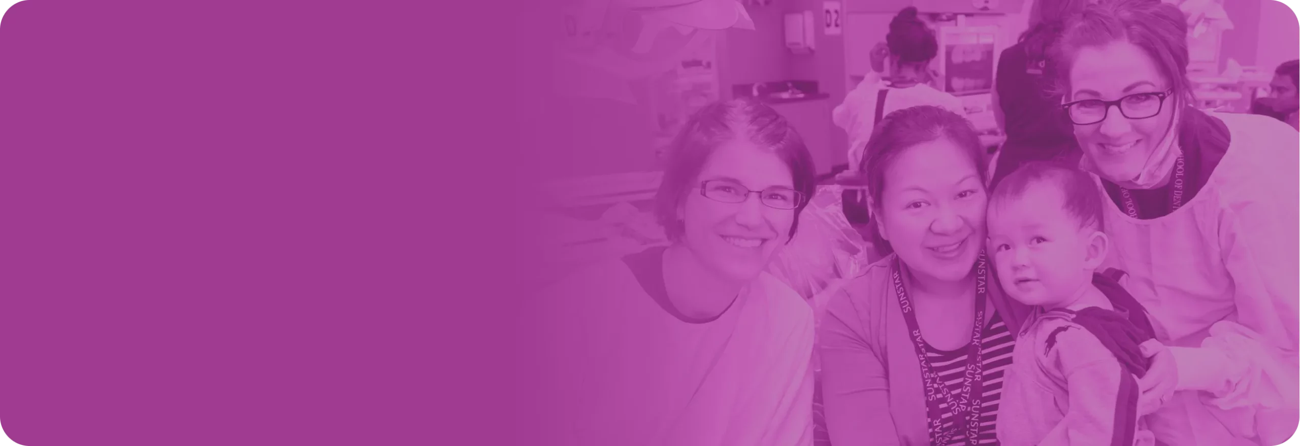 Two providers alongside of a mother and son patient.