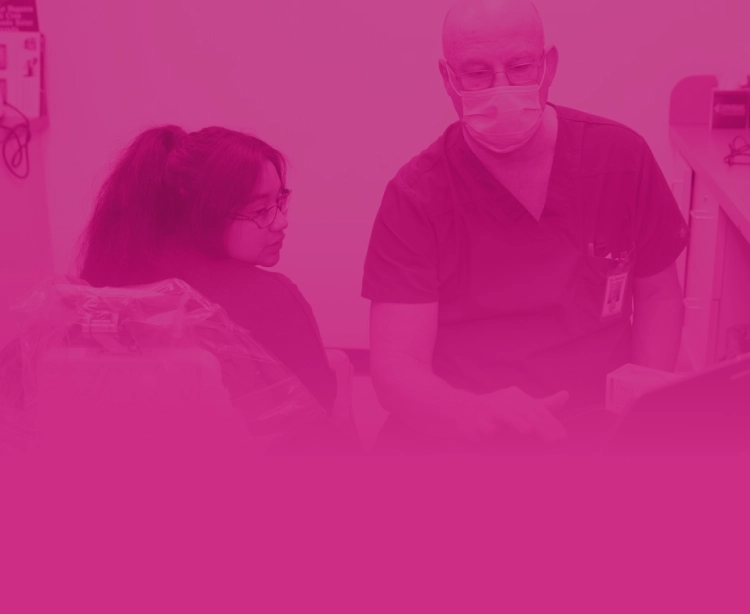 Two providers looking at a laptop.