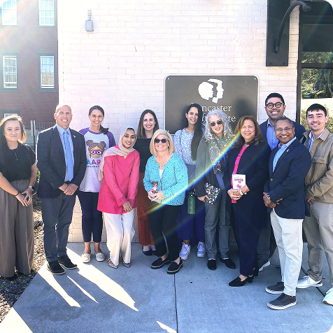 The team at Lancaster Cleft Palate Clinic, the first cleft palate clinic in the United States, stands with representatives from the AAPD Foundation.